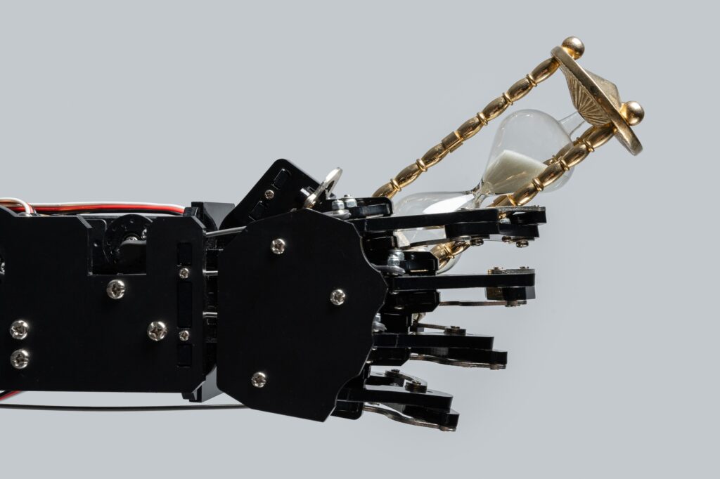Real robotic hand with sandglass.